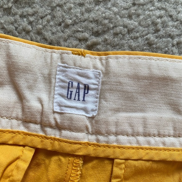 GAP High-Rise Pleated Khaki Shorts in Mustard Yellow - Picture 4 of 7